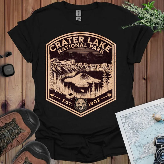 Crater Lake National Park rustic mountain shield graphic t-shirt shown in lifestyle or modeled setting