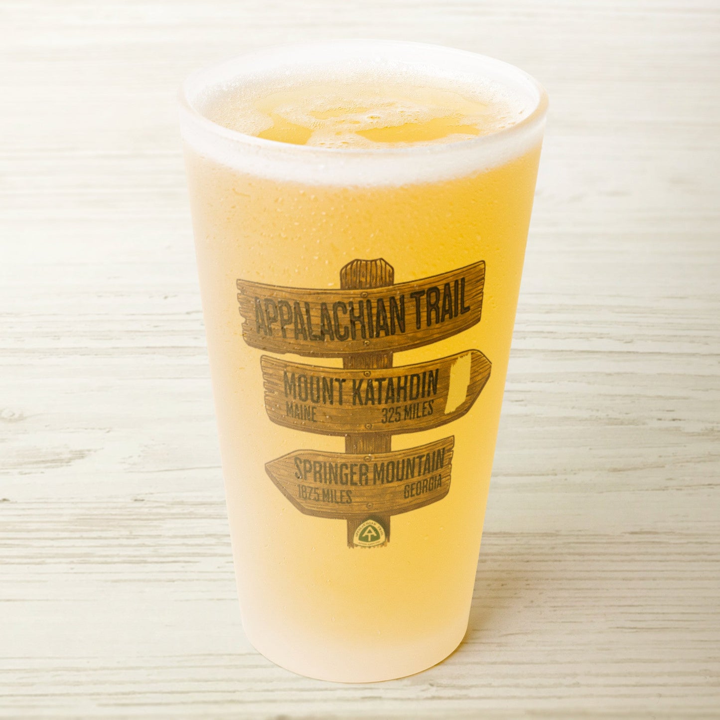 Appalachian Trail wood mileage sign 16 oz frosted pint glass shown from alternate product angle