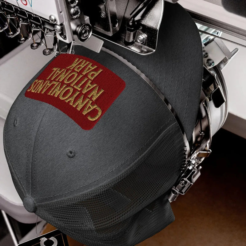 Canyonlands National Park sign embroidered trucker hat shown from alternate product angle