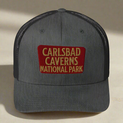 Carlsbad Caverns National Park sign embroidered trucker hat shown from alternate product angle