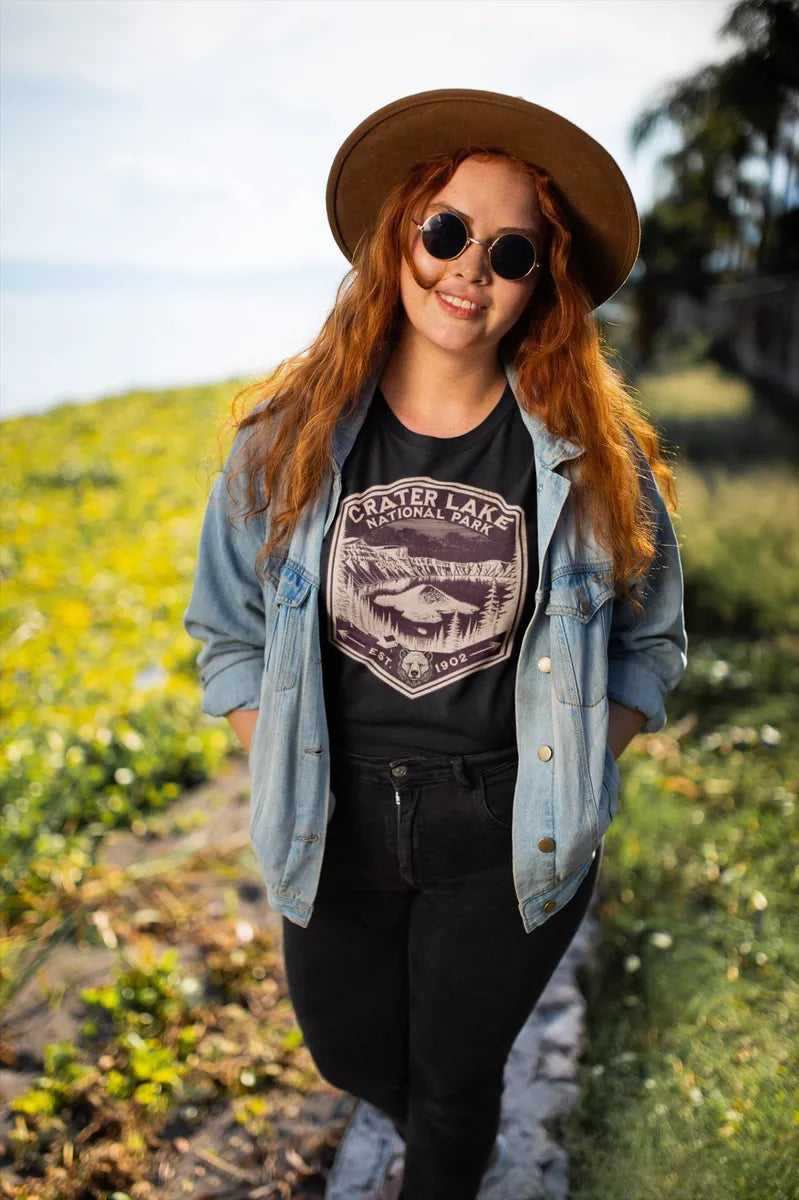 Crater Lake National Park rustic mountain shield graphic t-shirt shown in lifestyle or modeled setting
