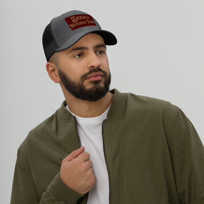 Denali National Park sign embroidered trucker hat shown in lifestyle or modeled setting