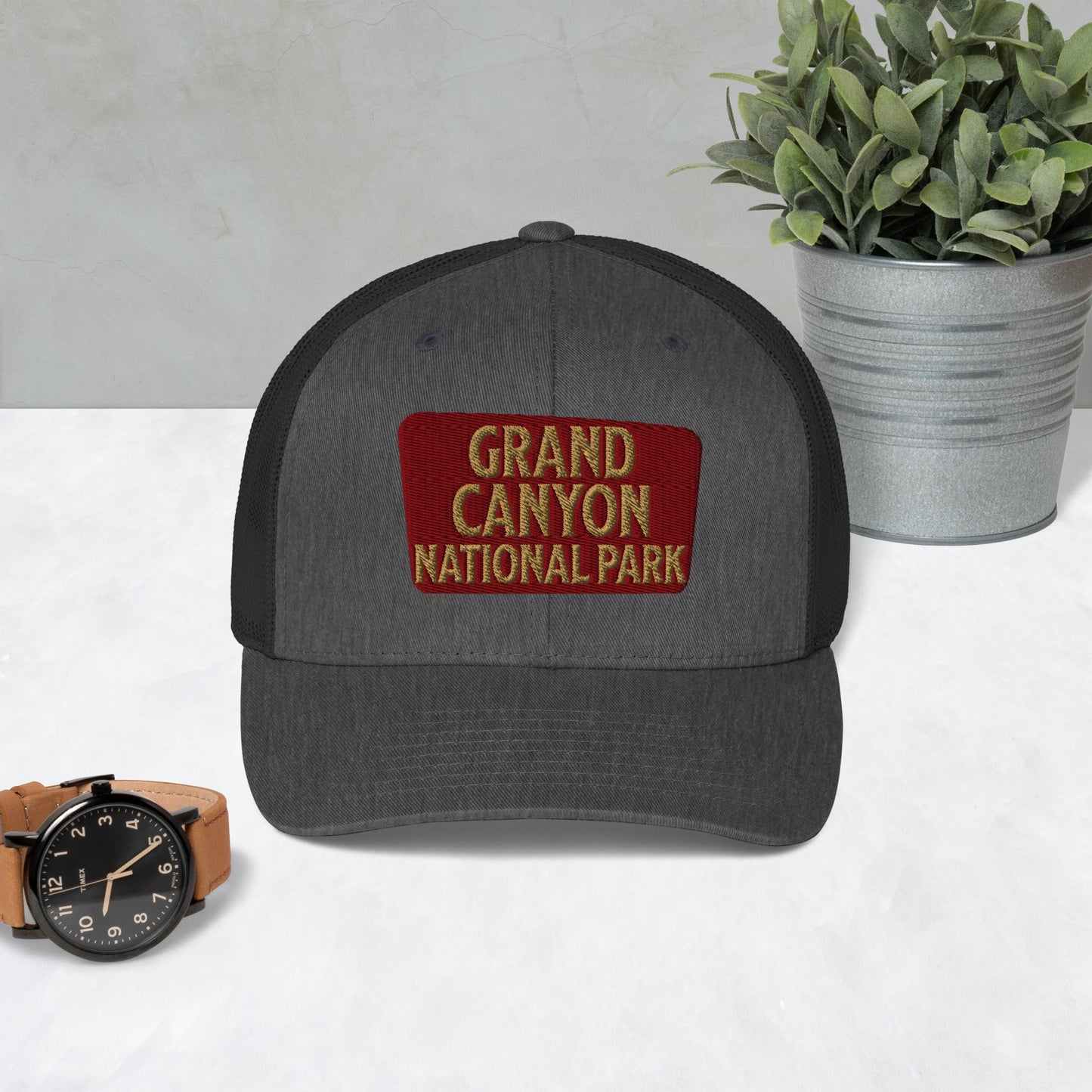 Grand Canyon National Park sign embroidered trucker hat shown in lifestyle or modeled setting