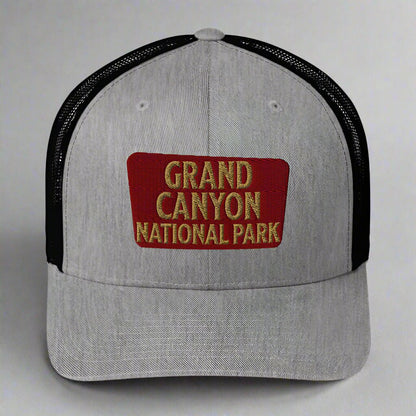 Grand Canyon National Park sign embroidered trucker hat shown in lifestyle or modeled setting