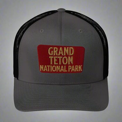 Grand Teton National Park sign embroidered trucker hat shown in lifestyle or modeled setting