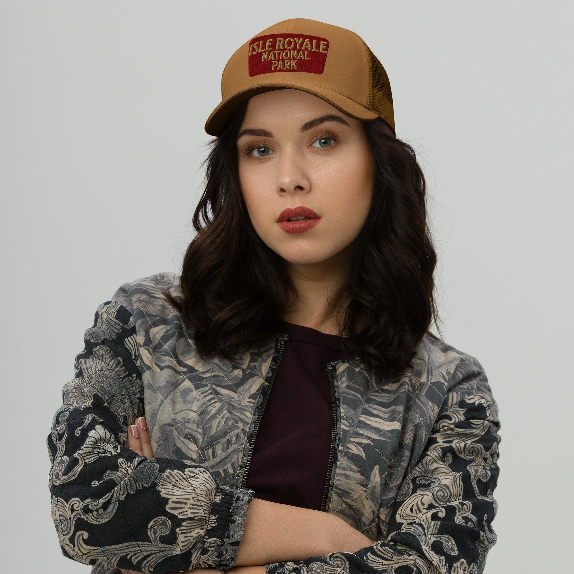 Isle Royale National Park sign embroidered trucker hat shown from alternate product angle