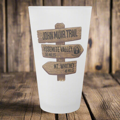 John Muir Trail wood mileage sign frosted pint glass shown as primary product image