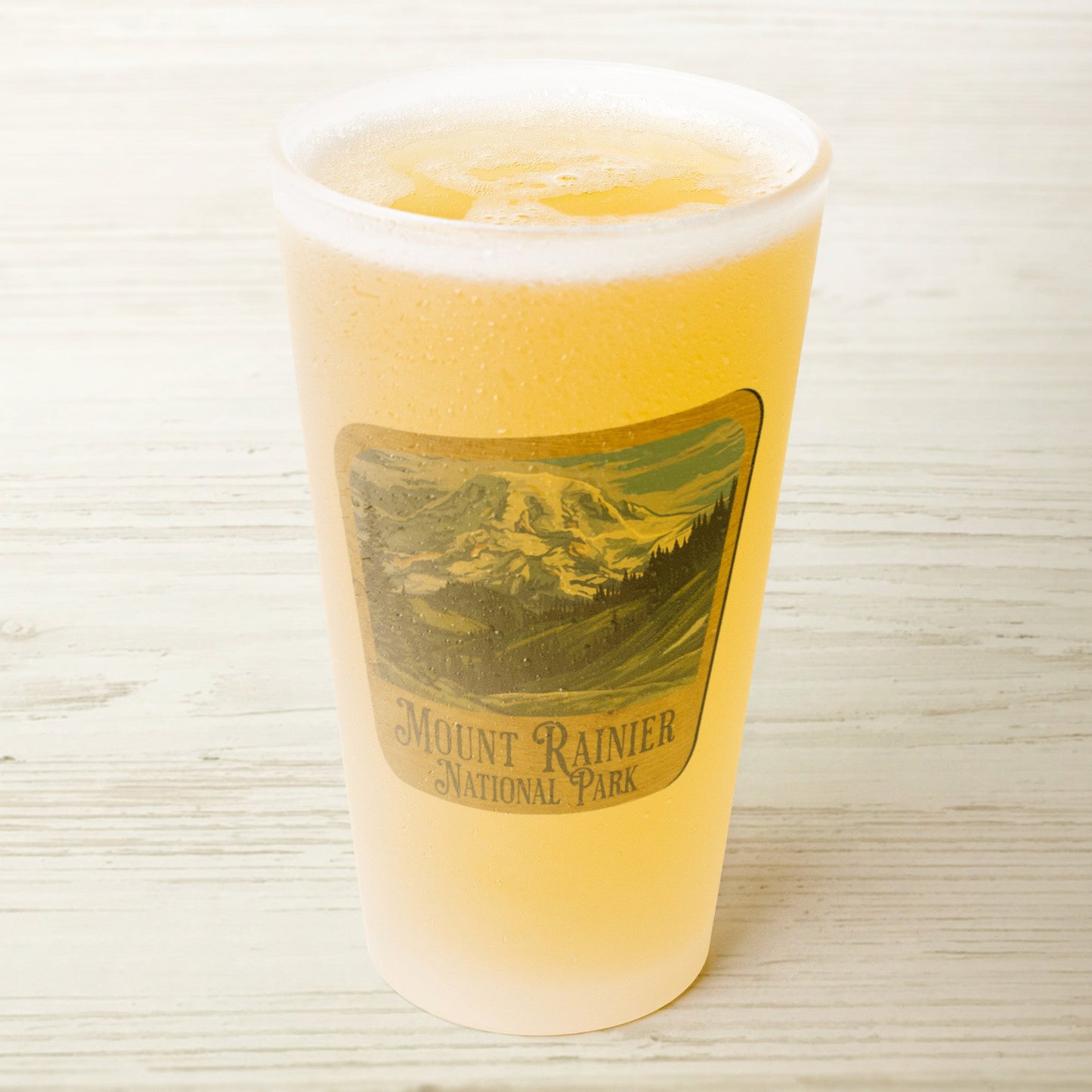 Mount Rainier National Park wood sign frosted pint glass shown from alternate product angle