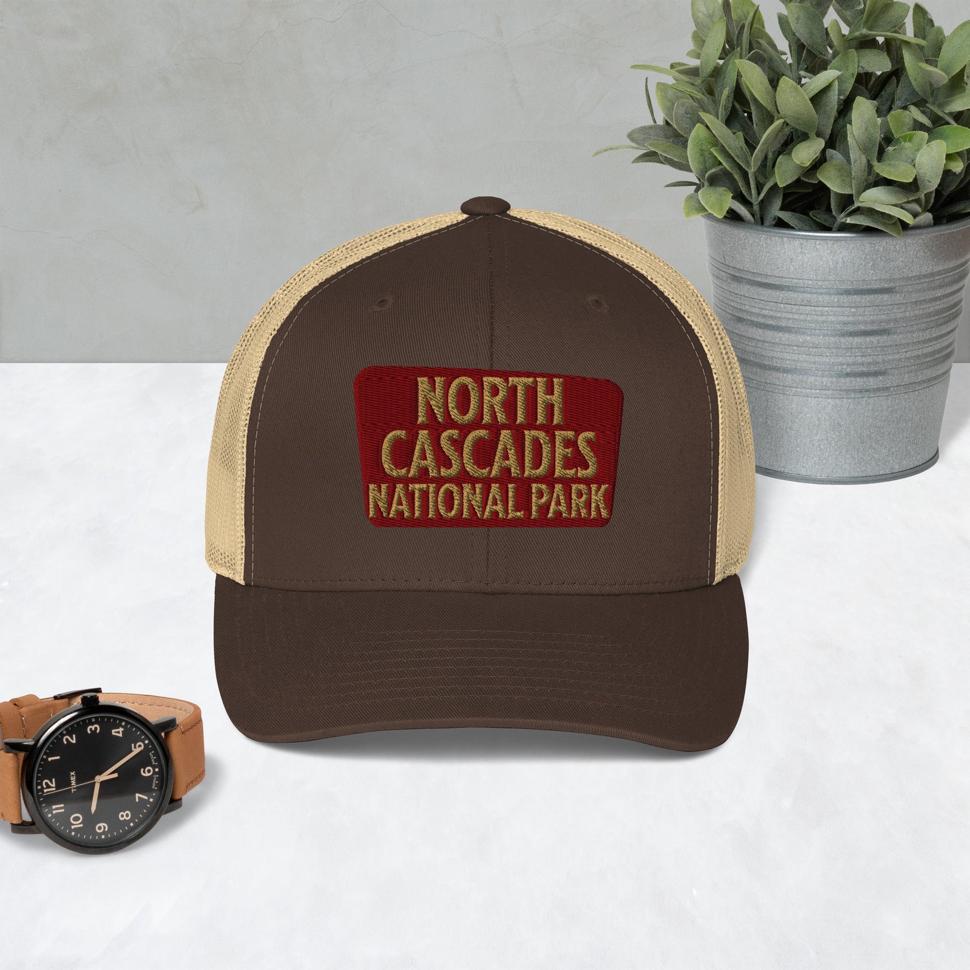 North Cascades National Park embroidered trucker hat shown in lifestyle or modeled setting