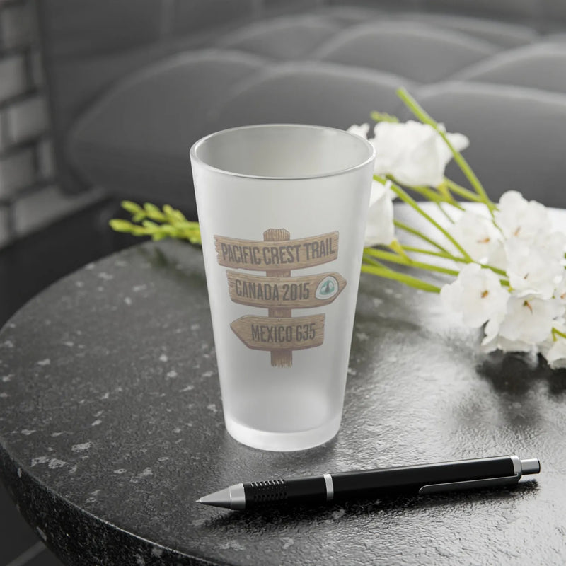 Pacific Crest Trail mileage sign frosted pint glass shown from alternate product angle