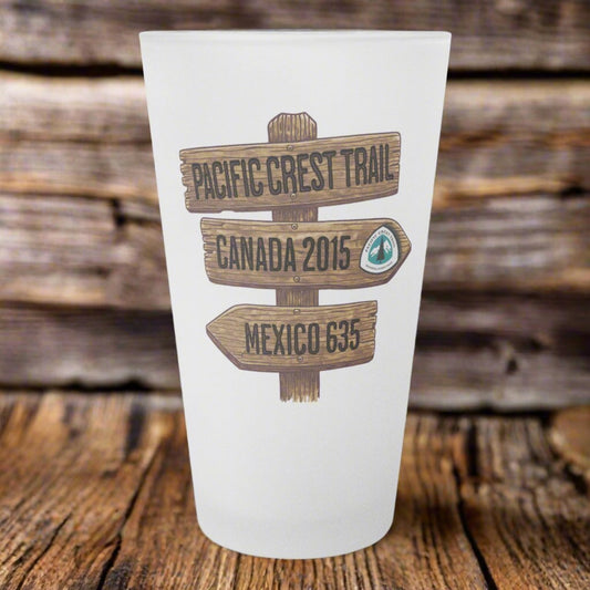 Pacific Crest Trail mileage sign frosted pint glass shown as primary product image