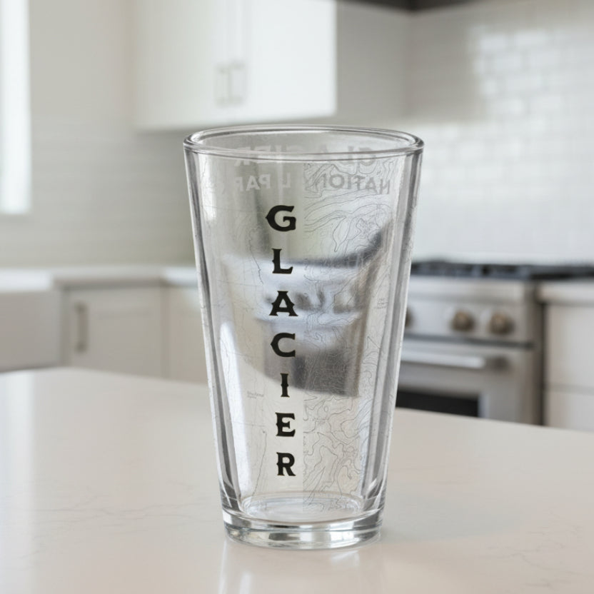 Clear glass with 'Glacier National Park' etching on a white background