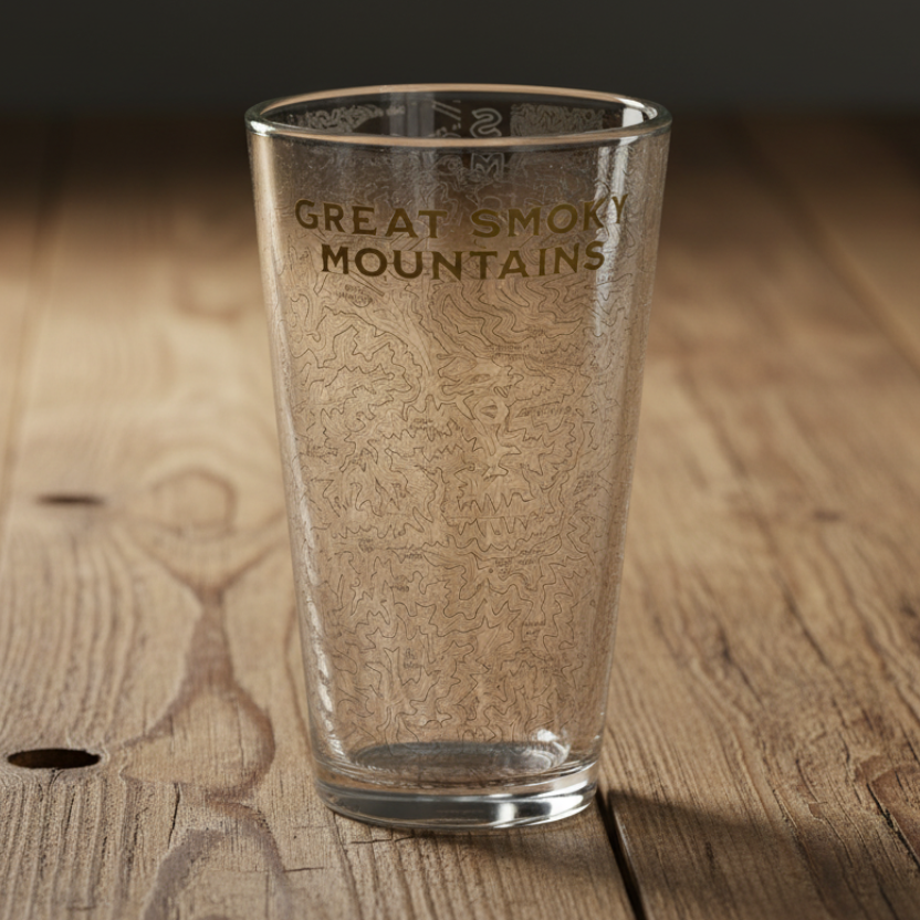 Clear glass with 'Great Smoky Mountains' engraving on a wooden surface