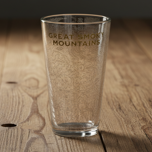 Clear glass with 'Great Smoky Mountains' engraving on a wooden surface