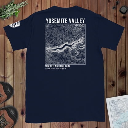 Navy blue t-shirt with Yosemite Valley map design on a wooden surface